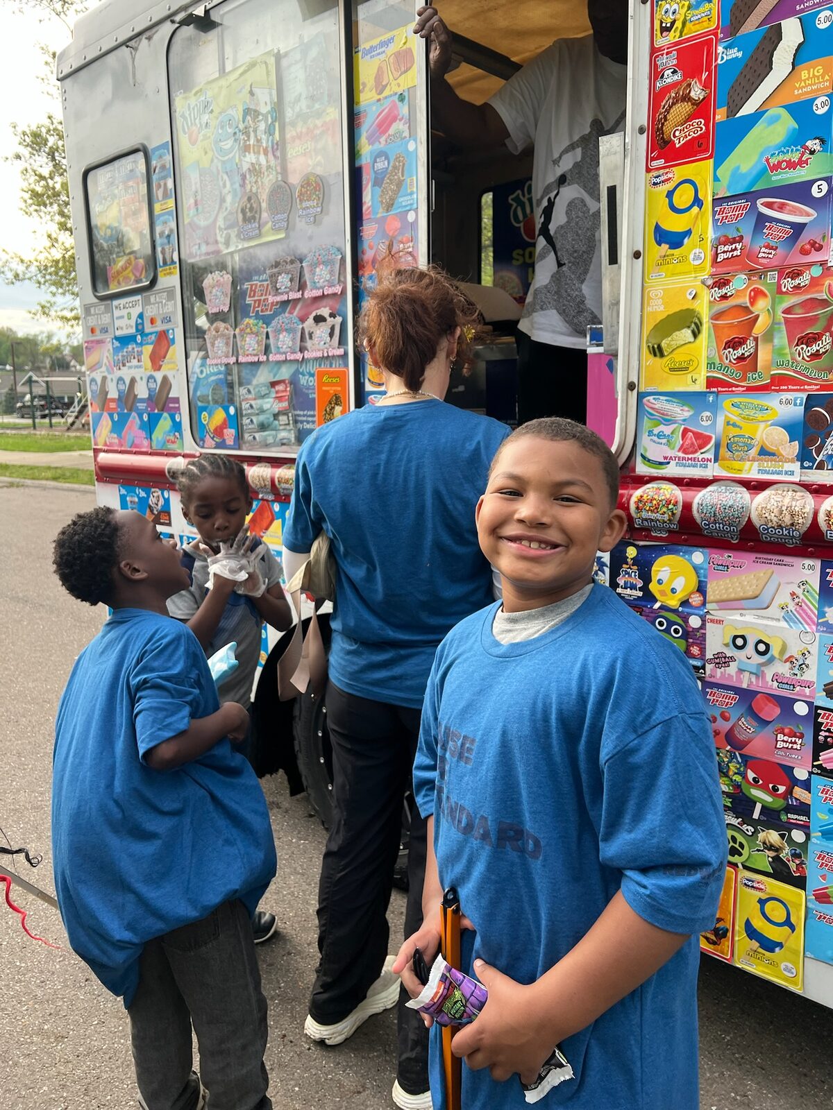 Smiling boy at a community ice cream truck event