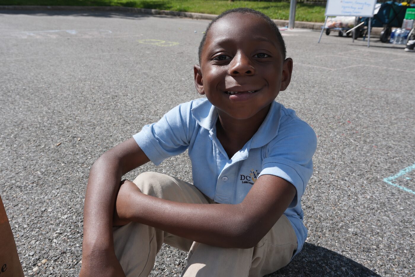 Smiling boy at a community event